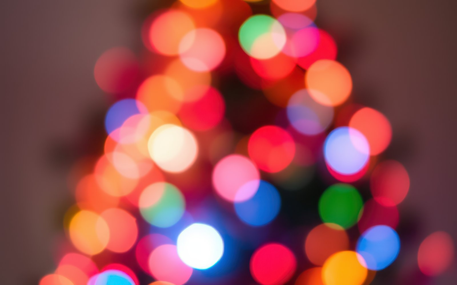 Colorful lights create a festive atmosphere on a Christmas tree during the holiday season